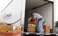 Juan, a Food Finders food rescue driver, loads donated surplus food into a Food Finders truck during a scheduled food rescue.