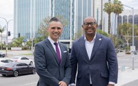 Port CEO Dr. Noel Hacegaba poses with Long Beach Mayor Rex Richardson in front of the port’s newly acquired building at 100 Oceangate.