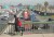 A MAN WALKS over the 710 Freeway jammed with semi-trucks as he heads west along Anaheim Street on Wednesday, Oct. 27, 2021. 
