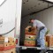 Juan, a Food Finders food rescue driver, loads donated surplus food into a Food Finders truck during a scheduled food rescue.