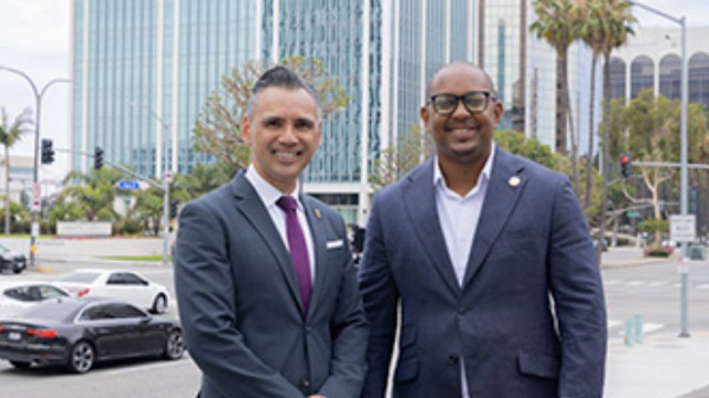 Port CEO Dr. Noel Hacegaba poses with Long Beach Mayor Rex Richardson in front of the port’s newly acquired building at 100 Oceangate.